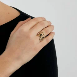Bague or bicolore motif serpent et grenats