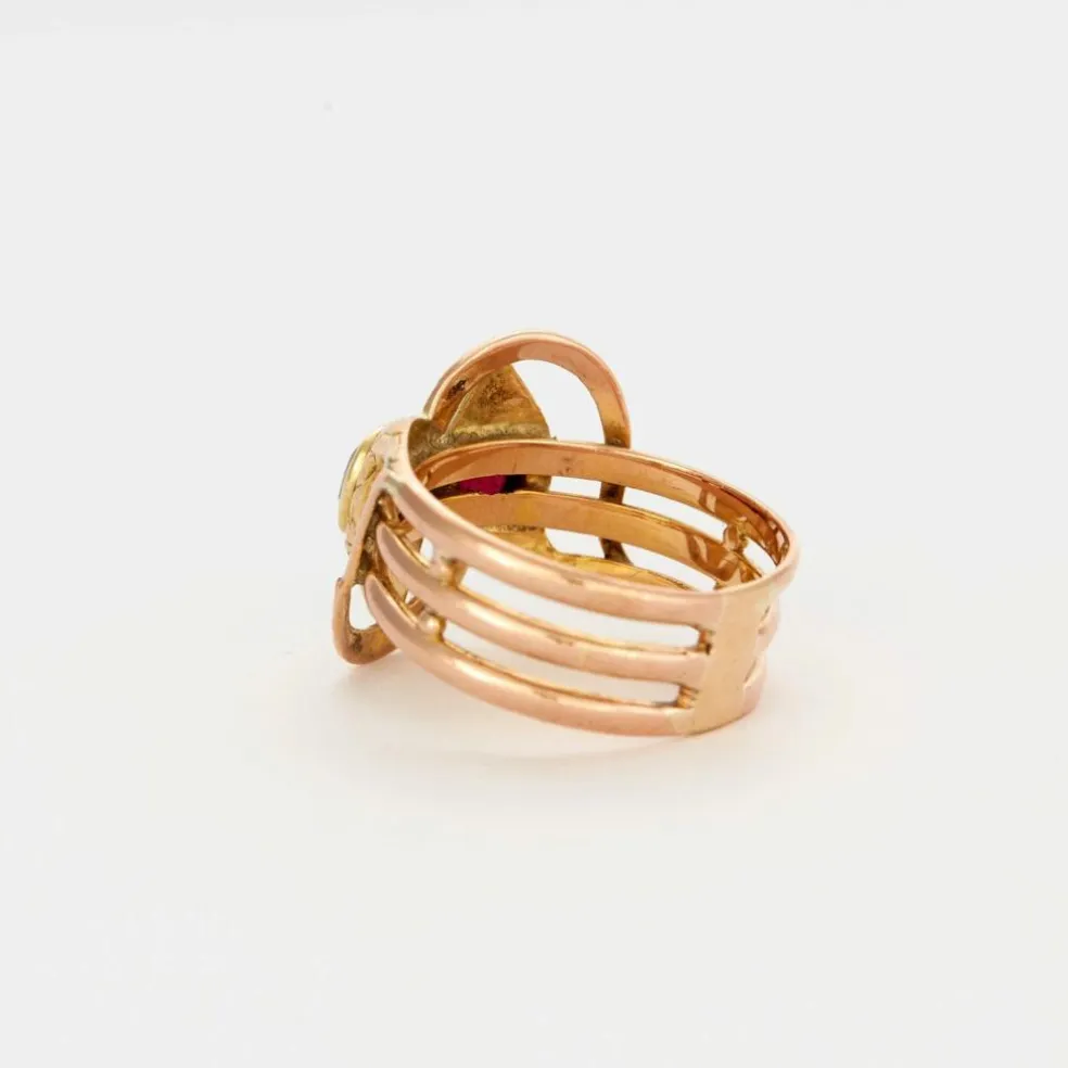 Bague or bicolore motif serpent et grenats