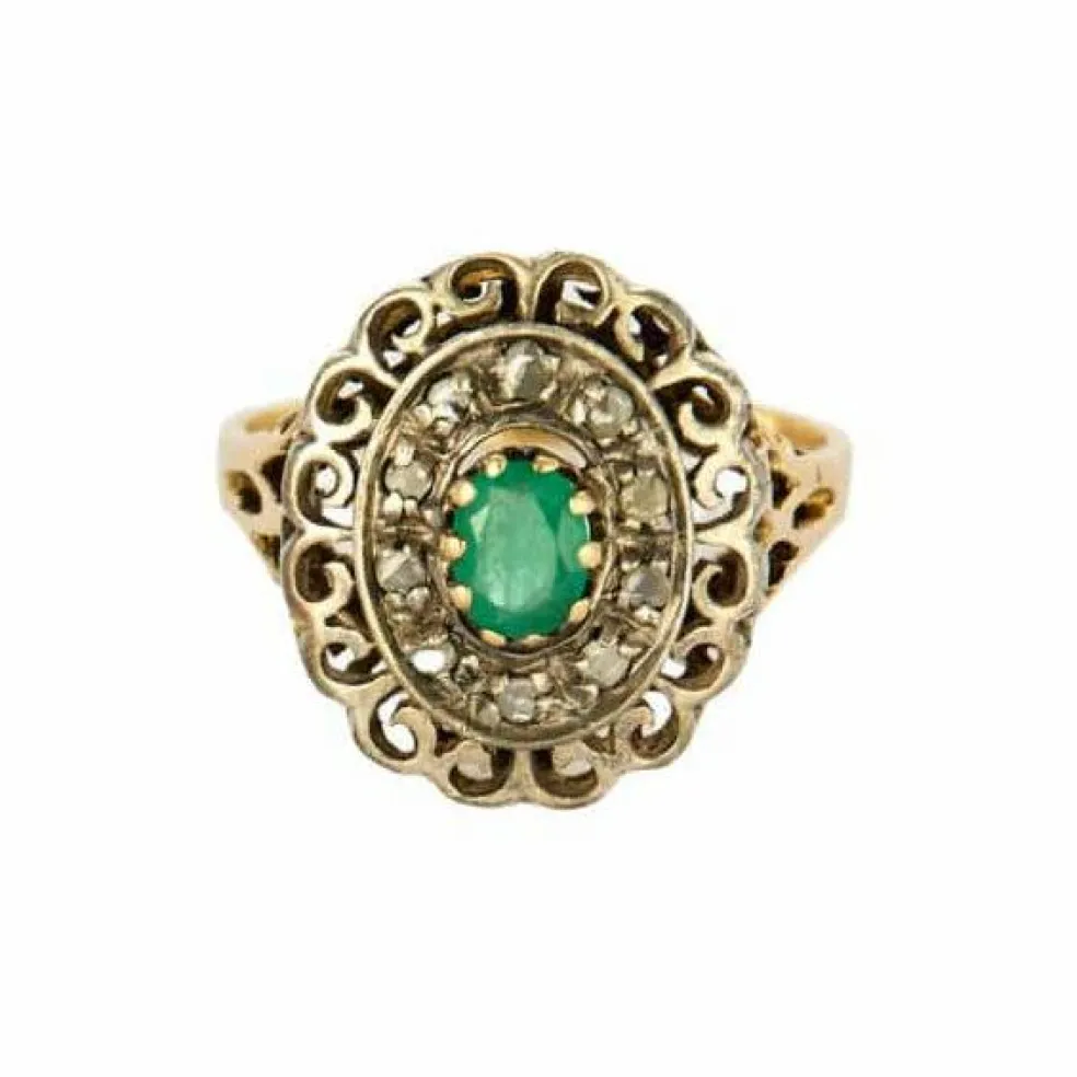 Bague or jaune et argent, centrée d'une émeraude