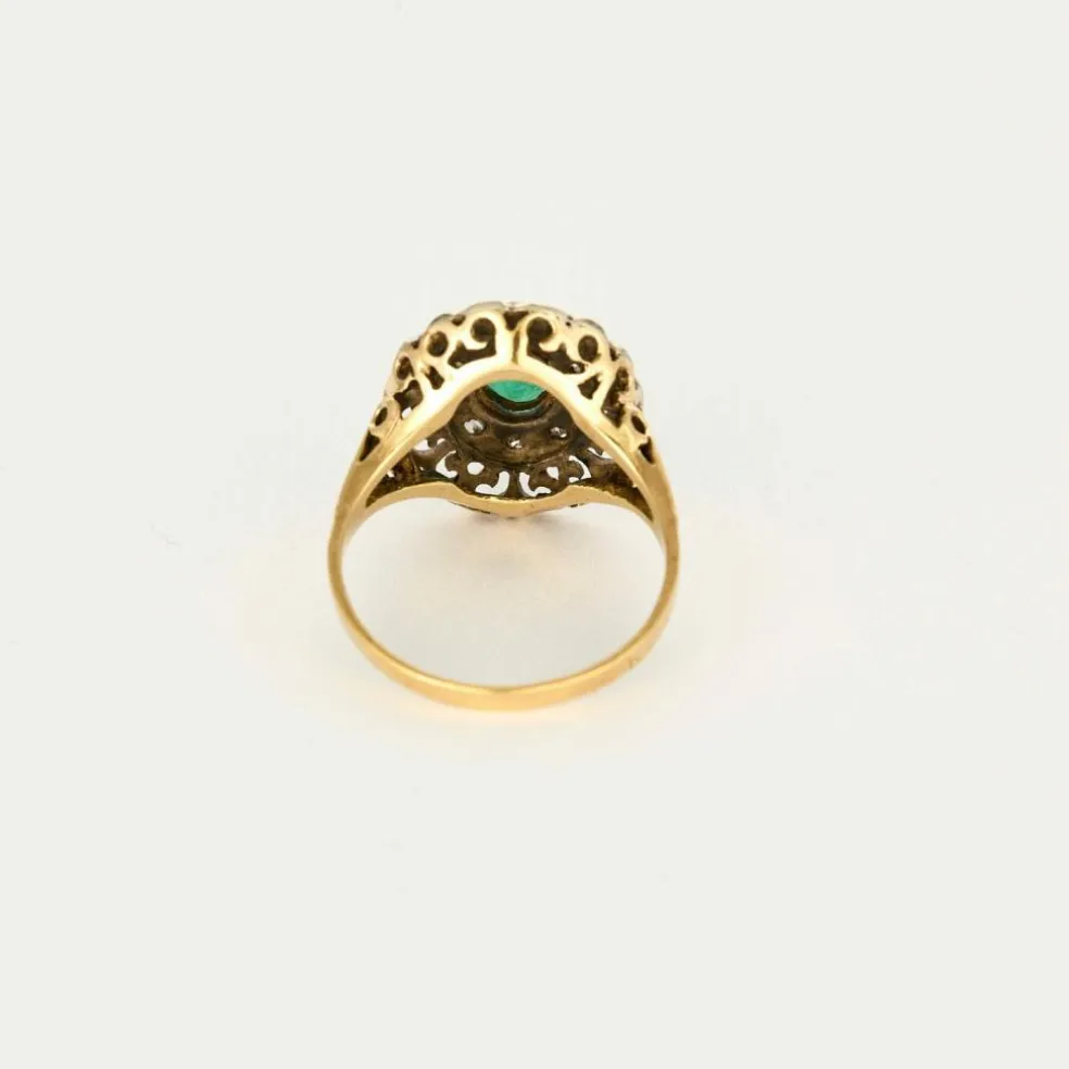 Bague or jaune et argent, centrée d'une émeraude