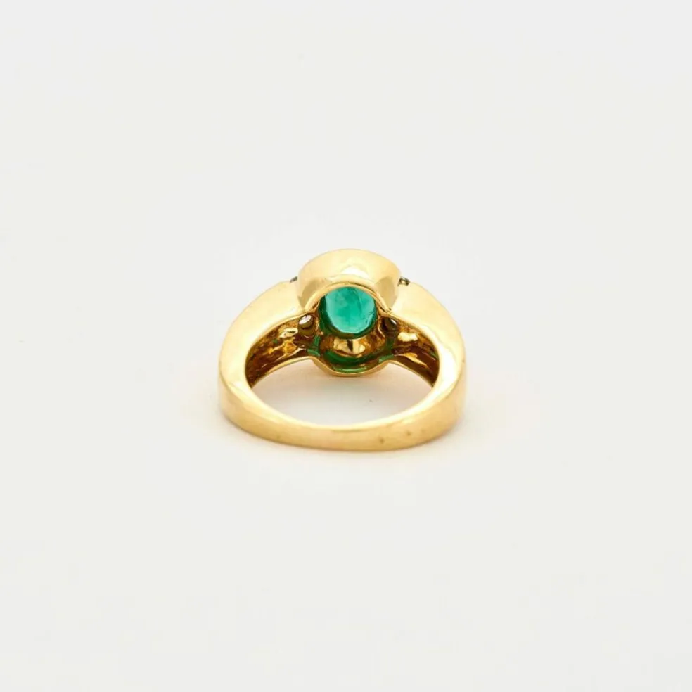 Bague or jaune émeraude serti clos et diamants
