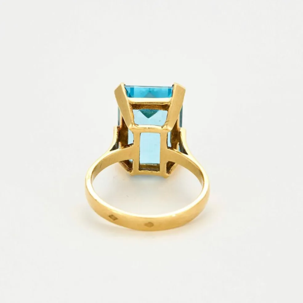 Bague or jaune topaze bleue