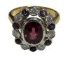 Bague ovale festonnée or 2 tons ornée d'une rhodolite