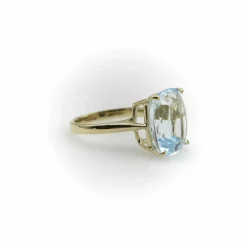 Bague Signature en or 14 carats et topaze bleu clair 6 carats