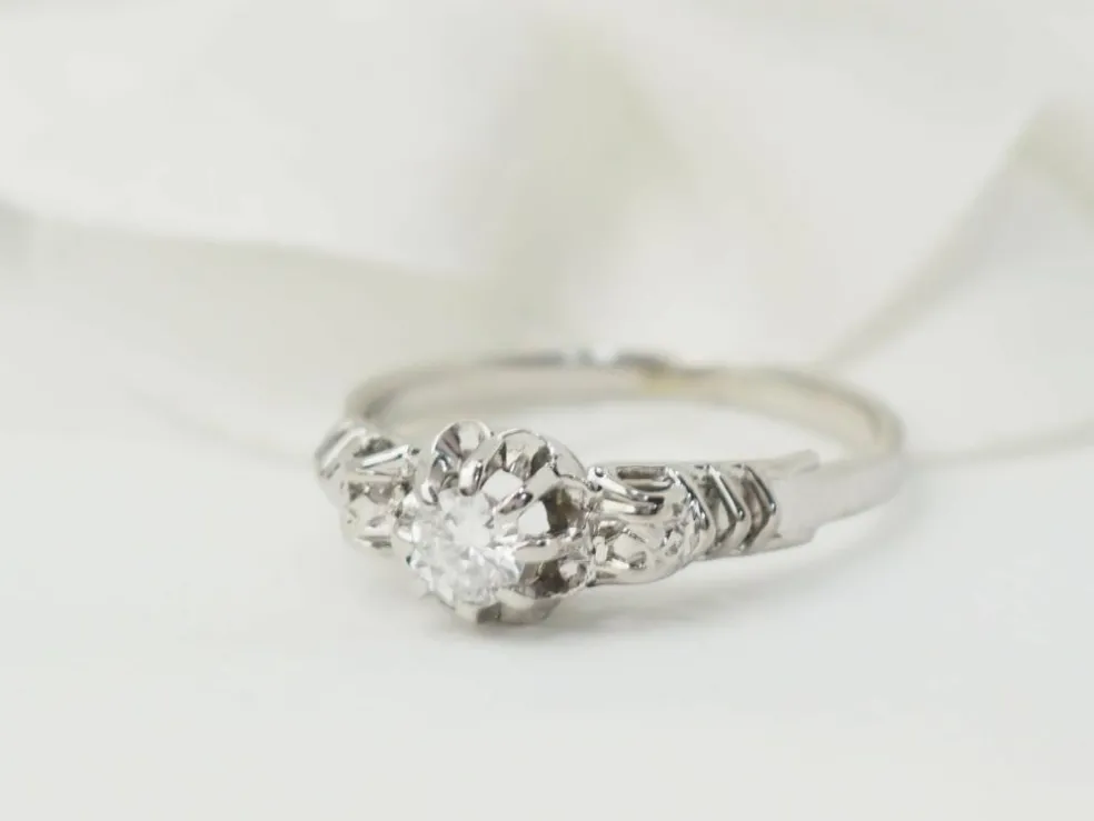 Bague solitaire en or blanc et platine, diamant 0,23ct