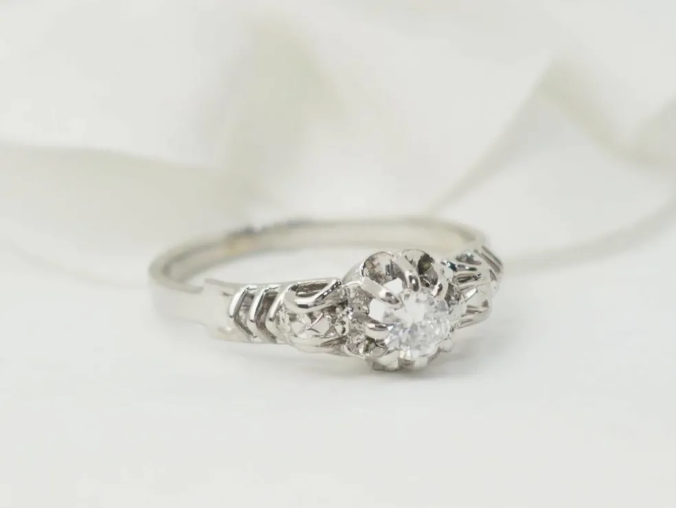 Bague solitaire en or blanc et platine, diamant 0,23ct