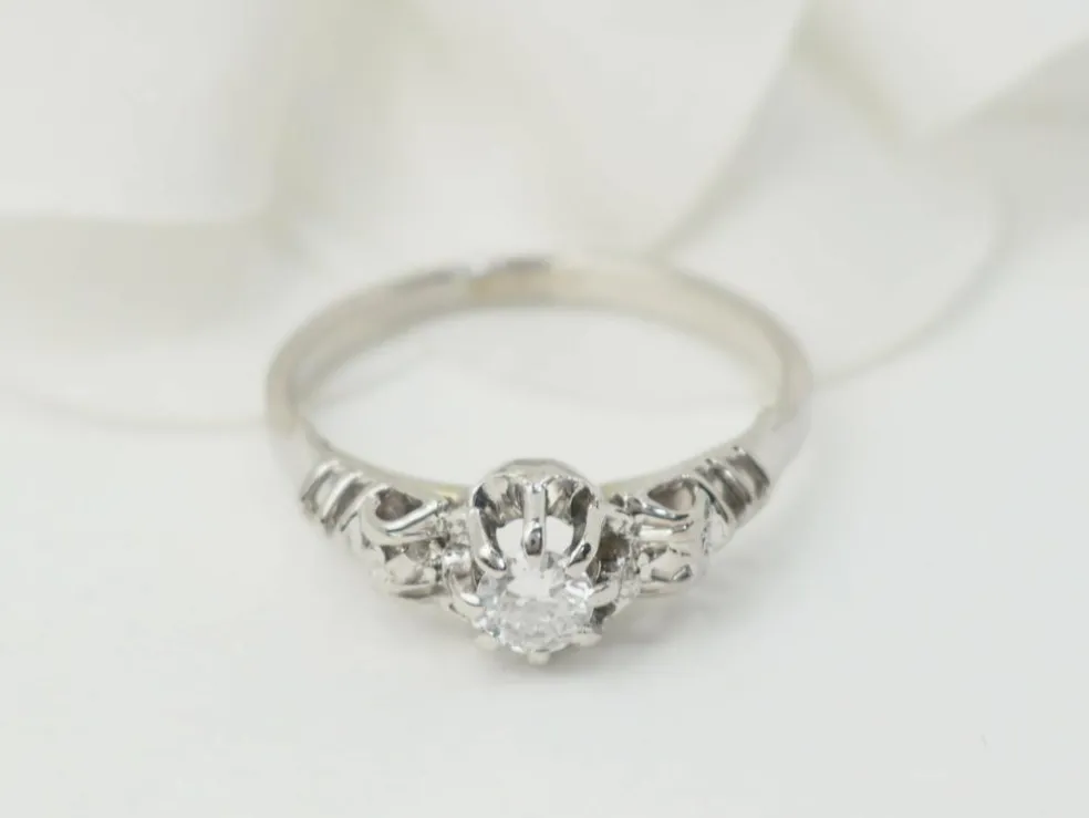 Bague solitaire en or blanc et platine, diamant 0,23ct