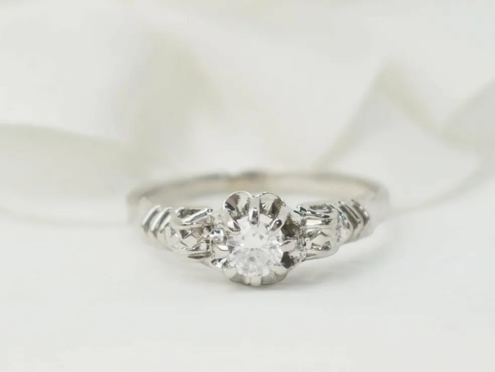 Bague solitaire en or blanc et platine, diamant 0,23ct