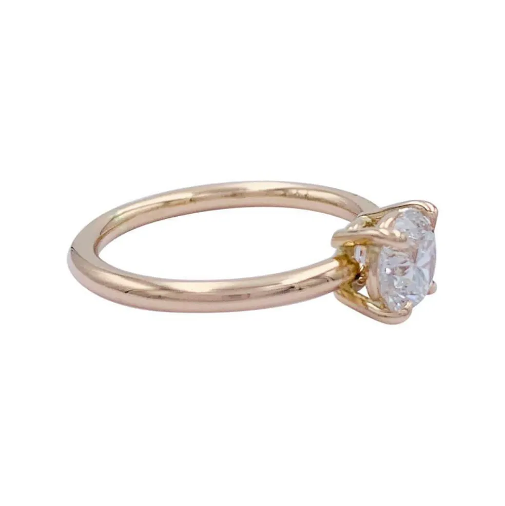 Bague solitaire en or rose, diamant 1 carat.