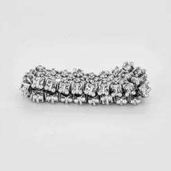 Bague souple, or gris et diamants