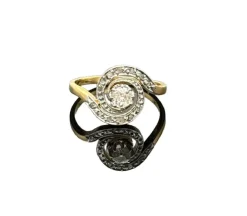 Bague tourbillon ancienne en or avec diamant