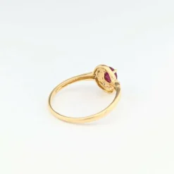 Bague tourbillon en or jaune diamants et rubis