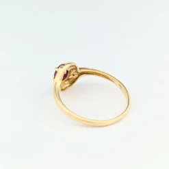 Bague tourbillon en or jaune diamants et rubis