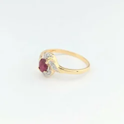 Bague tourbillon en or jaune diamants et rubis