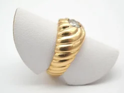 Bague tourbillon godronné en or jaune 750 mil
