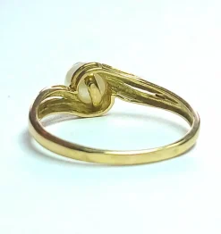 Bague tourbillon or jaune, perle