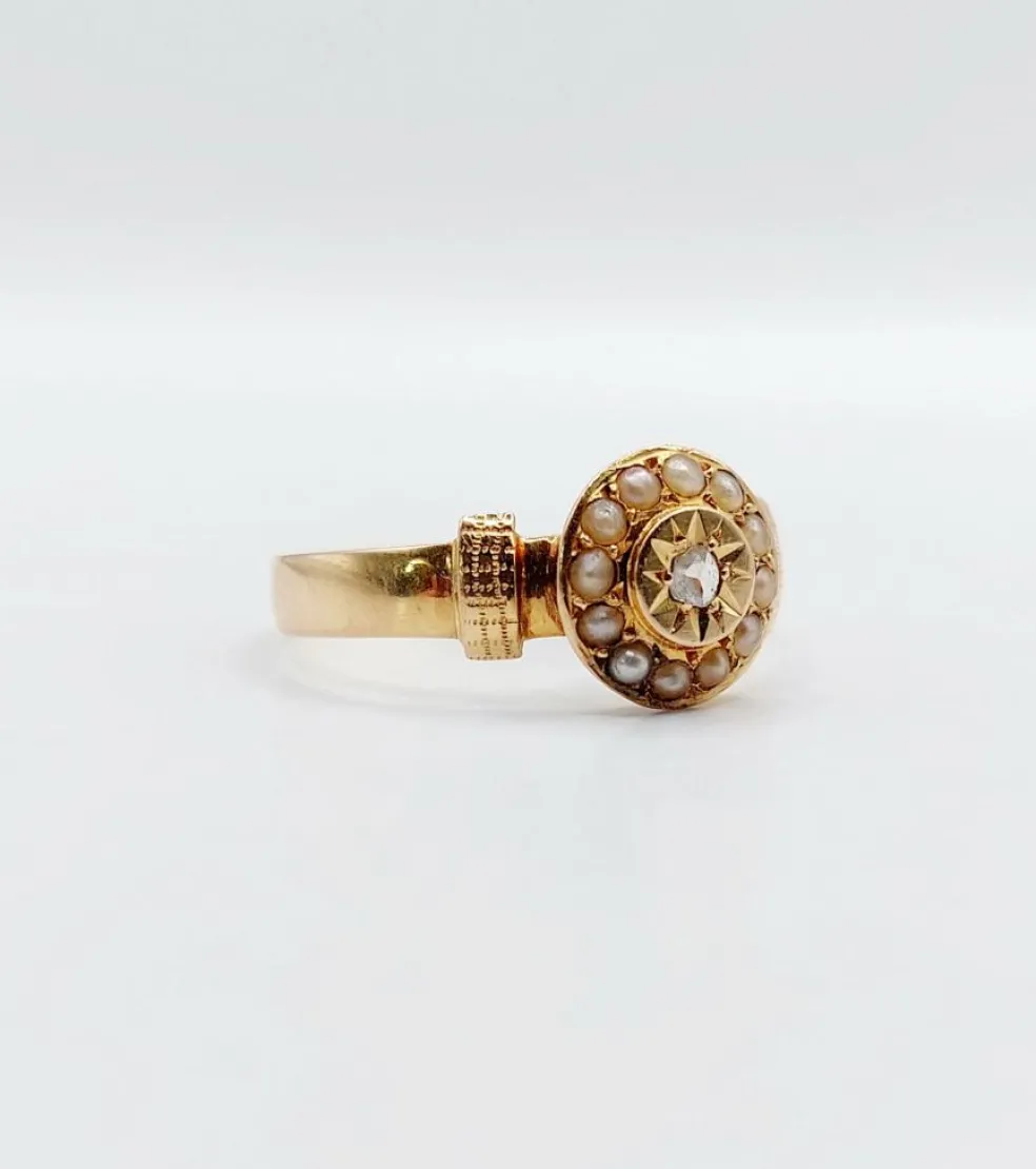 Bague victorienne or rose ornée d'un diamant en serti étoilé entouré de perles