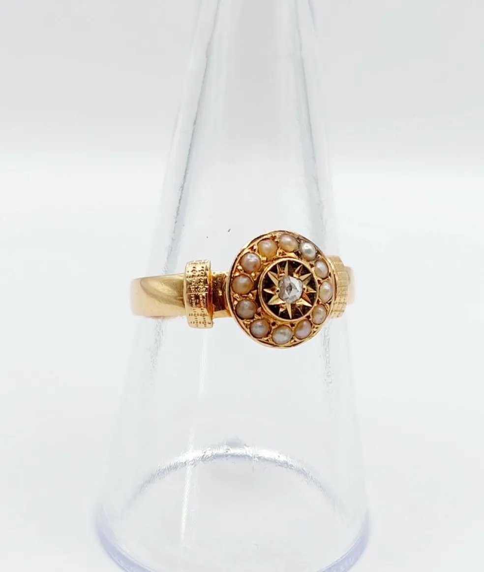 Bague victorienne or rose ornée d'un diamant en serti étoilé entouré de perles