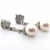 Boucles d'oreilles en or blanc avec perles et diamants