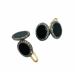 Boutons de manchette 1910 en or, argent, onyx et diamants.
