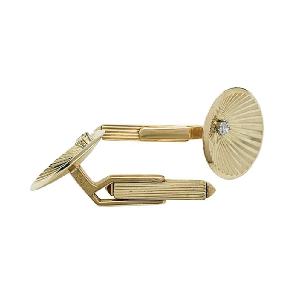 Boutons de manchette en or jaune et diamants.