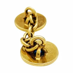 Boutons de manchette en or jaune, saphirs et diamants.