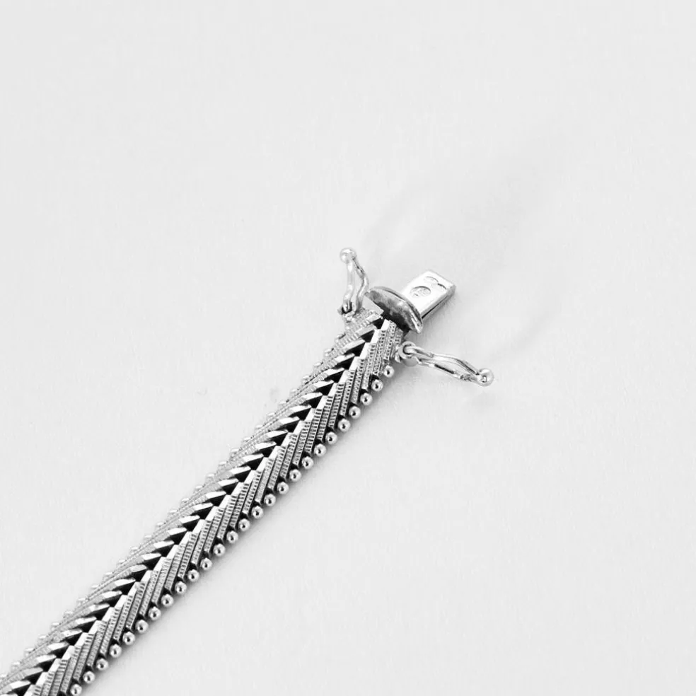 Bracelet années 60, or blanc et diamants