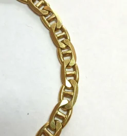 Bracelet gourmette en or jaune, maille marine battue