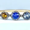 Bracelet jonc en or 18 carats, multipierres : saphir, topazes, citrine. Epoque Napoléon III.
