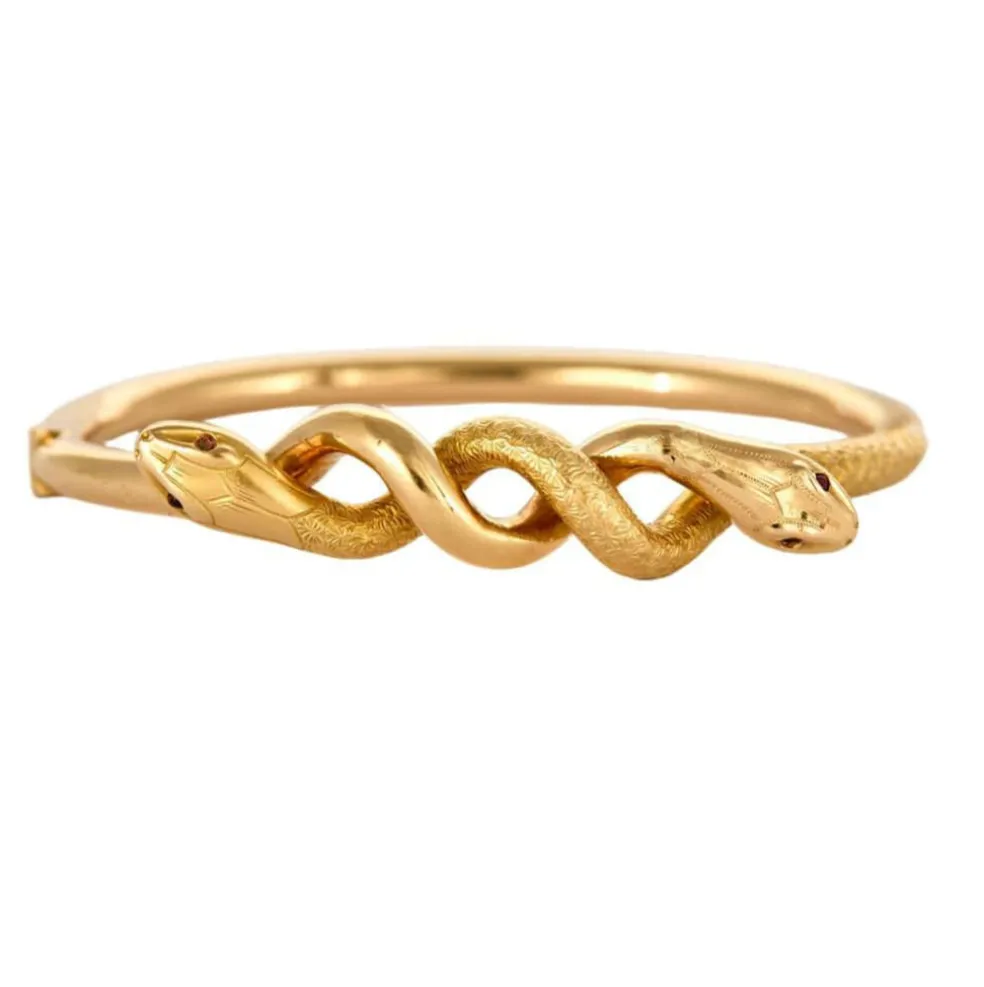 Bracelet jonc motif serpent en or jaune et rubis