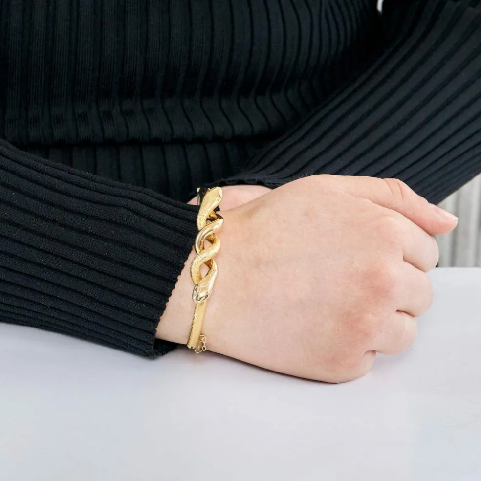 Bracelet jonc motif serpent en or jaune et rubis
