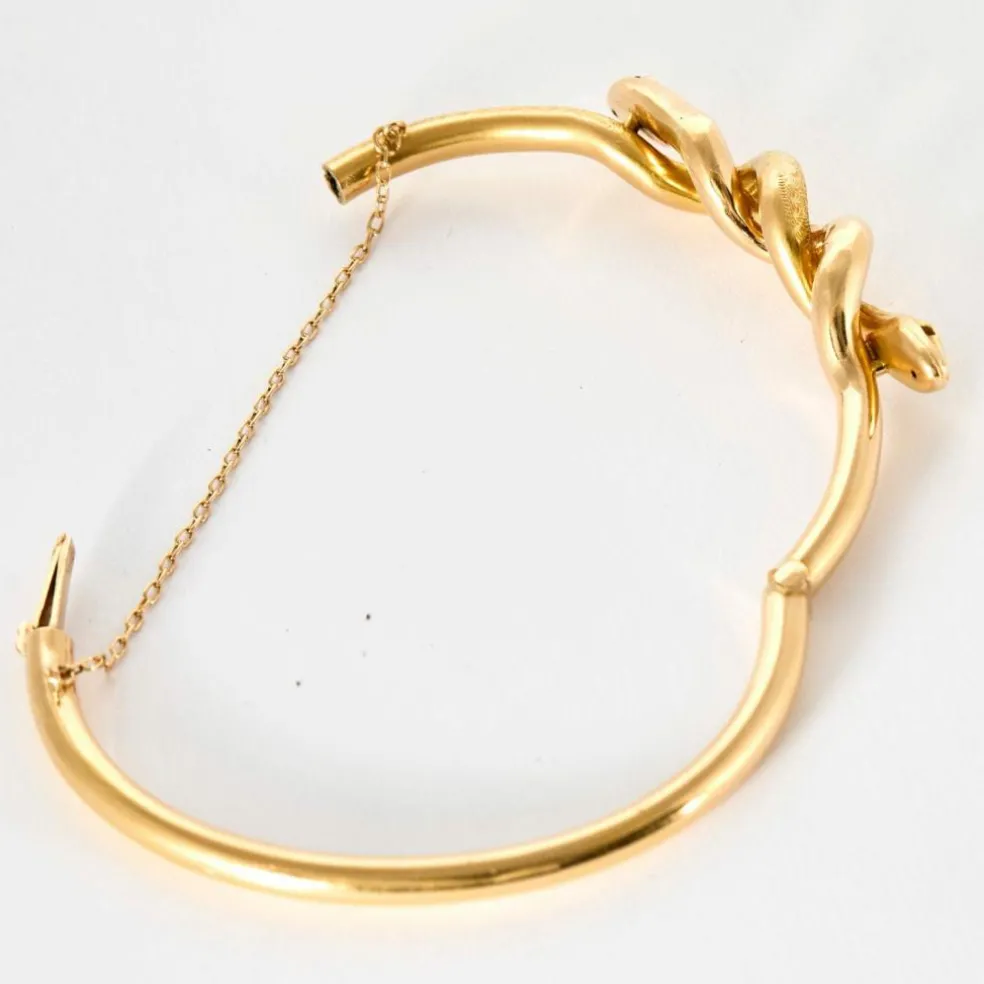 Bracelet jonc motif serpent en or jaune et rubis