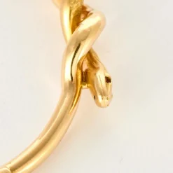 Bracelet jonc motif serpent en or jaune et rubis