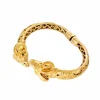 Bracelet jonc ouvrant en or jaune avec saphirs et diamants