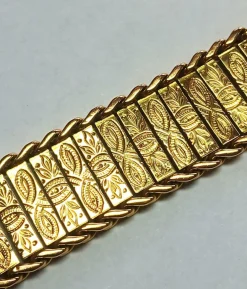 Bracelet manchette en or jaune à décor floral