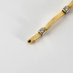 Bracelet moderniste en or jaune et gris, et diamants