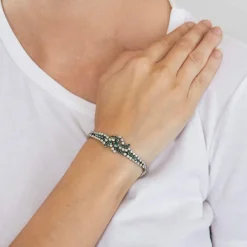 Bracelet or gris diamants et émeraudes