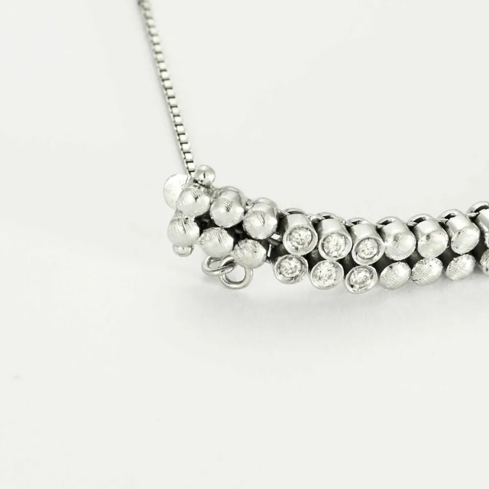 Bracelet or gris diamants et émeraudes