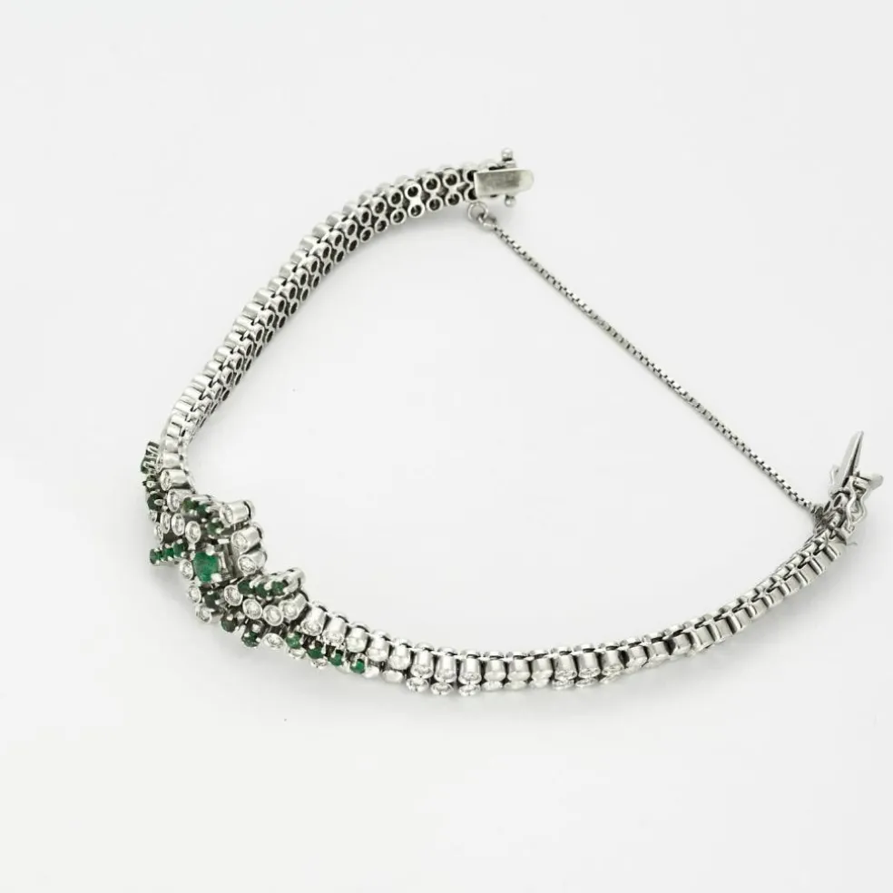 Bracelet or gris diamants et émeraudes