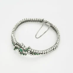 Bracelet or gris diamants et émeraudes