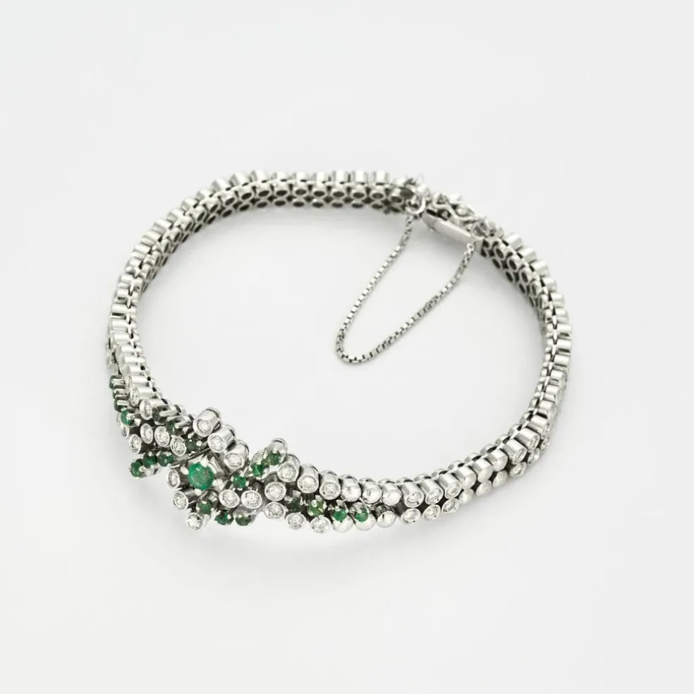 Bracelet or gris diamants et émeraudes