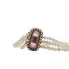 Bracelet or rose 18 carats serti de perles fines et pierre rose