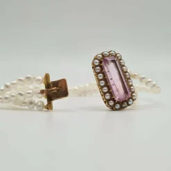 Bracelet or rose 18 carats serti de perles fines et pierre rose