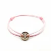 Bracelet or rose, diamants sur cordon signé Ely Bela