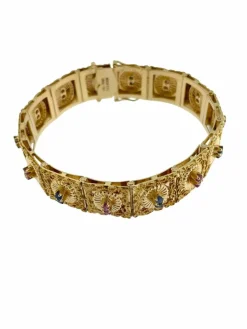 Bracelet rétro Brevetto en or jaune, rubis et saphirs