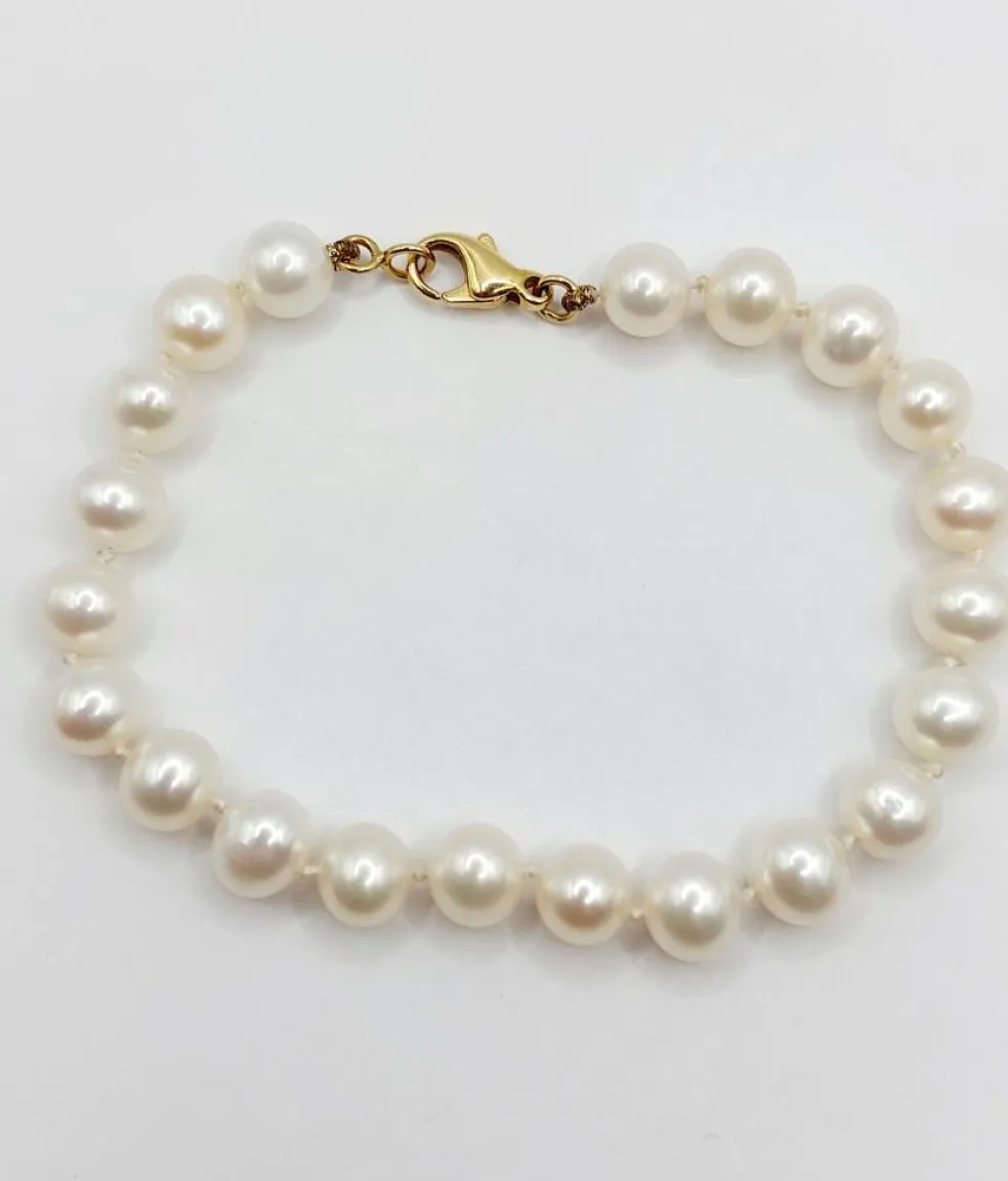 Bracelet vintage or jaune orné de perles de cultures