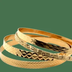 4 Bracelets joncs ciselés en or jaune