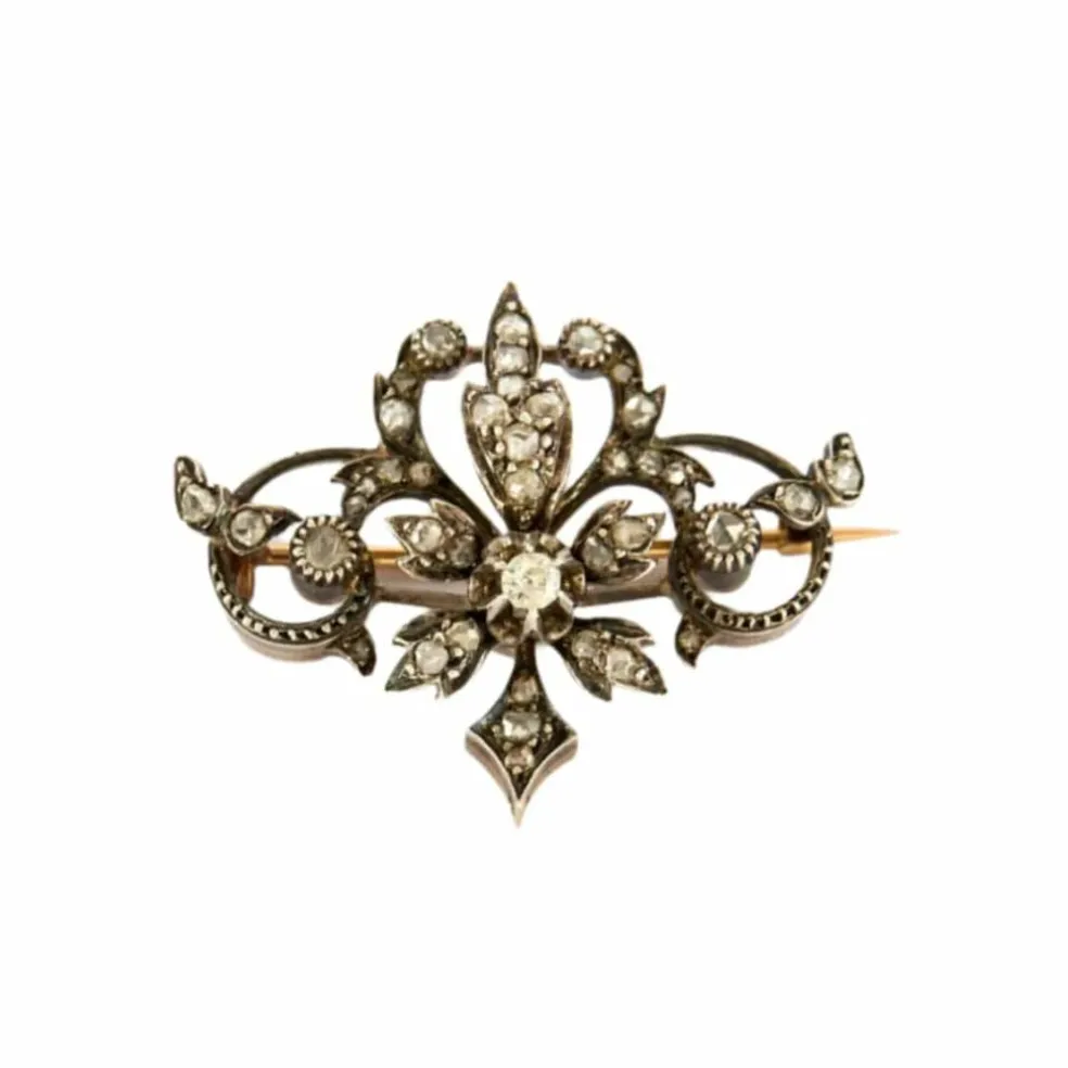 Broche à volutes, or rose et diamants
