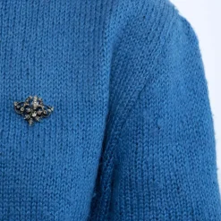 Broche à volutes, or rose et diamants