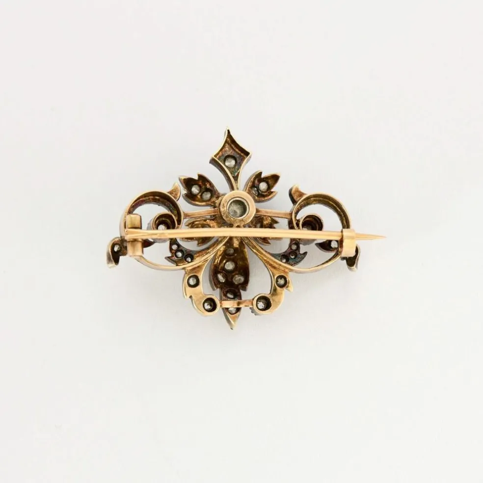 Broche à volutes, or rose et diamants